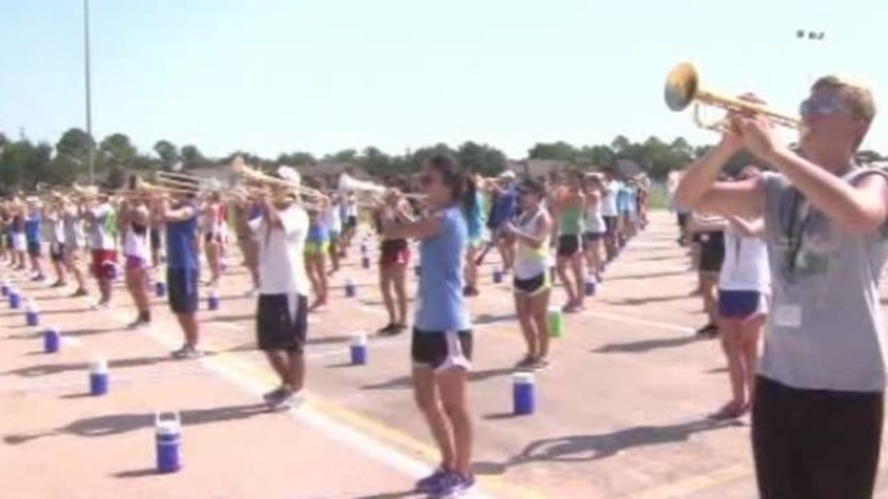 Marching bands battle heat to practice