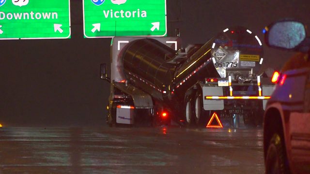 Crews work to clean up chemical spill after tanker truck buckles