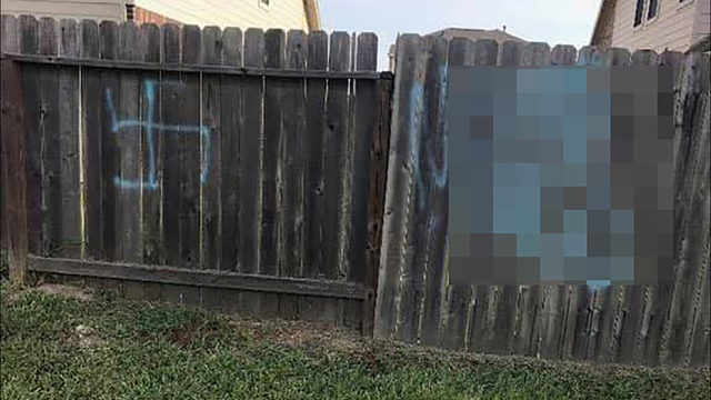 Neighbors' concerns grow after racist graffiti spray-painted on fence